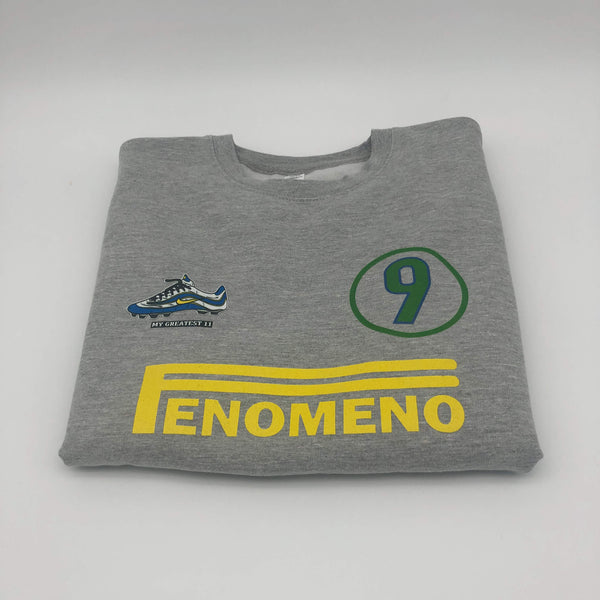 Front view of the Ronaldo “OFenómeno” sweatshirt in heather grey, featuring a bold graphic of Ronaldo and the iconic Nike Mercurial R9 boot.