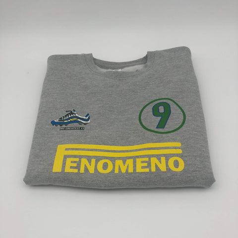 Front view of the Ronaldo “OFenómeno” sweatshirt in heather grey, featuring a bold graphic of Ronaldo and the iconic Nike Mercurial R9 boot.