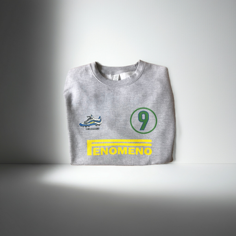 Front view of the Ronaldo “OFenómeno” sweatshirt in heather grey, featuring a bold graphic of Ronaldo and the iconic Nike Mercurial R9 boot.